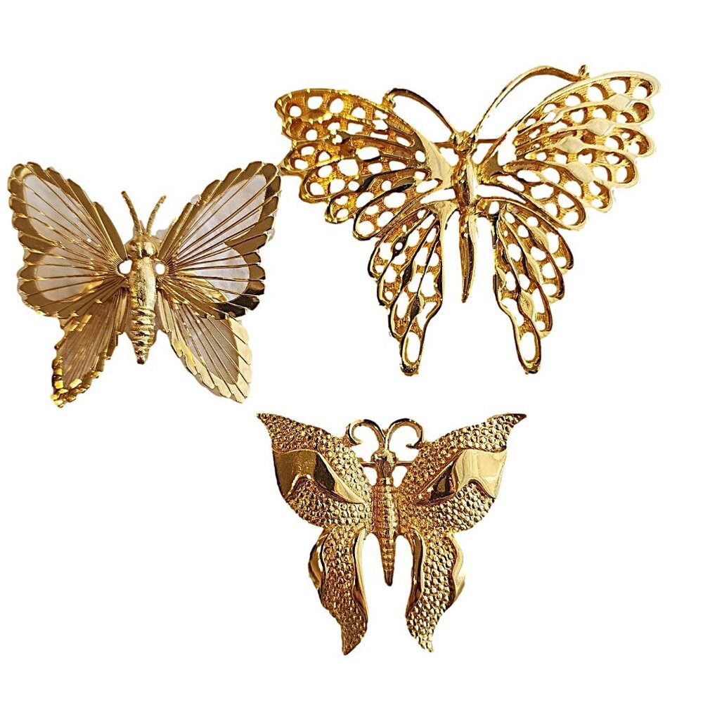 3 Butterfly Pins in Gold Toned Metal. One marked - Monet and one marked  D'ORLAN